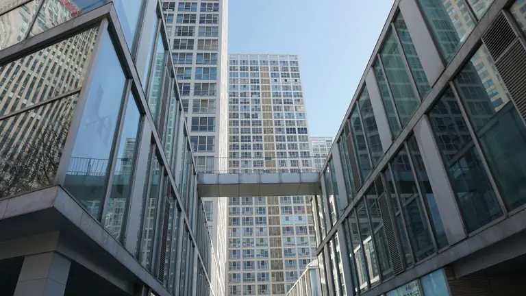 Stylish low angle view of contemporary skyscrapers showcasing modern architecture.