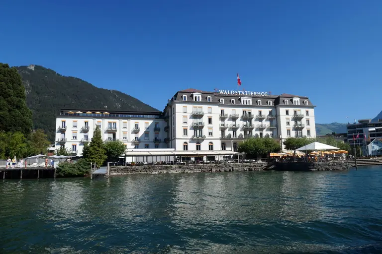 Scenic view of Waldstätterhof hotel by the lake in Ingenbohl, Switzerland.
