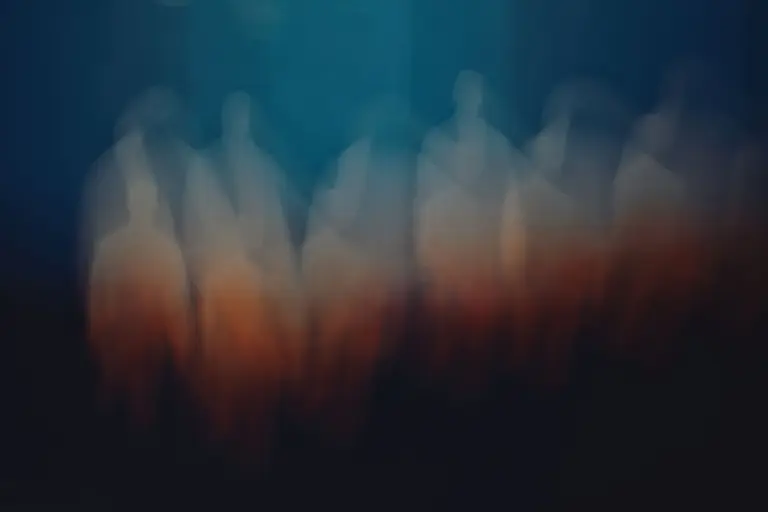 A captivating abstract image featuring blurred silhouettes in motion with a gradient background.